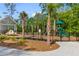 Community playground offers a green slide, climbing structure, and a covered picnic area at 137 Low Tide Ct, Charleston, SC 29492