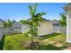 View of the backyard featuring a lawn, a small tree, a garden shed, and a brick walkway at 139 Clear Bend Ln, Summerville, SC 29486
