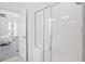 Bright bathroom featuring a glass enclosed shower with white tiled walls, and view into bedroom at 139 Clear Bend Ln, Summerville, SC 29486