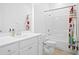 Bright bathroom featuring a white vanity, neutral-toned walls, and a shower with colorful curtain at 139 Clear Bend Ln, Summerville, SC 29486
