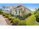 An inviting home featuring a cozy front porch, lush landscaping, and a well-manicured lawn at 139 Clear Bend Ln, Summerville, SC 29486