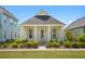 Charming single-story home featuring a covered porch with classic columns and manicured landscaping at 139 Clear Bend Ln, Summerville, SC 29486