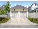 Two-car garage with carriage doors and exterior lighting at 139 Clear Bend Ln, Summerville, SC 29486