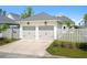 Two-car garage with carriage doors and exterior lighting at 139 Clear Bend Ln, Summerville, SC 29486