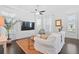 Bright living room featuring hardwood floors, stylish decor, and large windows for an airy, inviting space at 139 Clear Bend Ln, Summerville, SC 29486