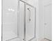 Modern shower equipped with glass doors, a shower bench and white subway tiles at 139 Clear Bend Ln, Summerville, SC 29486