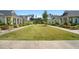 Serene street view featuring homes with covered front porches and well-manicured lawns at 139 Clear Bend Ln, Summerville, SC 29486