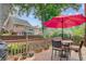 Outdoor deck with patio furniture, perfect for outdoor dining and entertaining, complemented by lush landscaping at 1391 Southlake Dr, Mount Pleasant, SC 29464