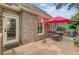 Back deck area with an umbrella table set and a grill for outdoor gatherings and relaxation at 1391 Southlake Dr, Mount Pleasant, SC 29464