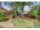 Spacious backyard with mature trees, lush lawn, and a wooden deck for outdoor enjoyment at 1391 Southlake Dr, Mount Pleasant, SC 29464