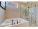 A relaxing bathroom with a soaking tub and a large walk-in shower featuring elegant tile work at 1391 Southlake Dr, Mount Pleasant, SC 29464