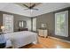 Spacious bedroom featuring hardwood floors, tray ceilings, and natural light at 1391 Southlake Dr, Mount Pleasant, SC 29464