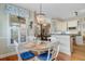 Bright breakfast nook featuring a round table, hardwood floors, and elegant light fixture at 1391 Southlake Dr, Mount Pleasant, SC 29464