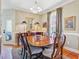 Formal dining room featuring a large wooden table, seating for six, and elegant decor and finishes at 1391 Southlake Dr, Mount Pleasant, SC 29464
