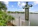 Inviting lake view from a charming dock with a rustic 'Welcome' sign on a sunny day at 1391 Southlake Dr, Mount Pleasant, SC 29464