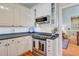 Clean kitchen features white cabinetry, modern appliances, and hardwood flooring at 1391 Southlake Dr, Mount Pleasant, SC 29464