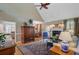 Spacious living room featuring a fireplace, hardwood floors, stylish furniture, and dining room view at 1391 Southlake Dr, Mount Pleasant, SC 29464