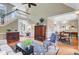 Open-concept living room with hardwood floors, a cozy seating area, and a view into the dining room at 1391 Southlake Dr, Mount Pleasant, SC 29464