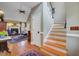 Elegant foyer with staircase leading to a living room with fireplace, vaulted ceiling, and hardwood floors at 1391 Southlake Dr, Mount Pleasant, SC 29464
