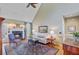 Cozy living room featuring a fireplace, hardwood floors, a ceiling fan and stylish furniture at 1391 Southlake Dr, Mount Pleasant, SC 29464