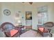 Relaxing screened porch with wicker seating and a view to the kitchen entry at 1391 Southlake Dr, Mount Pleasant, SC 29464