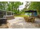 Large backyard with a hot tub, outdoor dining, and additional dwelling at 14 Paula Dr, Charleston, SC 29407
