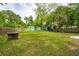 Spacious backyard with a storage shed, additional living space, and play area at 14 Paula Dr, Charleston, SC 29407