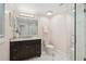 Stylish bathroom featuring a dark vanity, marble countertops, and glass-enclosed shower at 14 Paula Dr, Charleston, SC 29407