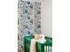 Close-up of a cozy Bedroom with blue floral wallpaper, green crib, and a soft teddy bear at 14 Paula Dr, Charleston, SC 29407