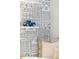 Whimsical bedroom decor with custom wallpaper and a blue toy truck on a shelf, adding character to the room at 14 Paula Dr, Charleston, SC 29407