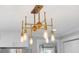 A statement brass chandelier illuminates this kitchen space with style at 14 Paula Dr, Charleston, SC 29407