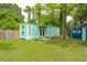 Exterior of additional dwelling with a blue storage shed on a large lot at 14 Paula Dr, Charleston, SC 29407