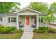 The home features a delightful front porch, perfect for relaxing in rocking chairs at 14 Paula Dr, Charleston, SC 29407