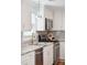 Stylish kitchen featuring white cabinetry, granite countertops, and stainless steel appliances at 14 Paula Dr, Charleston, SC 29407
