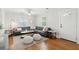 Bright living room with hardwood floors, a comfortable gray sectional, and stylish decor at 14 Paula Dr, Charleston, SC 29407