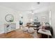 Spacious living room with hardwood floors, a cozy sectional, and plenty of natural light at 14 Paula Dr, Charleston, SC 29407