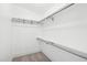 Bright walk-in closet with shelving and chrome rods to maximize storage space and organization at 14 Paula Dr, Charleston, SC 29407