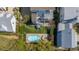 Aerial view showcasing a backyard with a pool, outdoor lounge area, and lush landscaping for a private oasis at 1427 Wando View St, Charleston, SC 29492