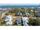 An aerial view showcasing a charming coastal neighborhood with waterfront homes and lush greenery at 1427 Wando View St, Charleston, SC 29492