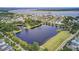 A high altitude aerial view of a community lake surrounded by homes and green space at 1427 Wando View St, Charleston, SC 29492