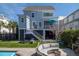 Backyard with pool, turfed lawn, outdoor kitchen area, and lounge seating at 1427 Wando View St, Charleston, SC 29492