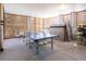 Spacious basement area with ping pong table, storage and concrete flooring, perfect for recreation and storage at 1427 Wando View St, Charleston, SC 29492