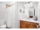 Bathroom featuring a shower with a white curtain, and a vanity with wood cabinets at 1427 Wando View St, Charleston, SC 29492