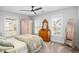 Bright bedroom with a bed, vintage furniture, and two windows at 1427 Wando View St, Charleston, SC 29492