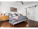 Bedroom featuring hardwood floors, modern nightstands and ensuite bathroom with sliding door at 1427 Wando View St, Charleston, SC 29492