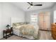 Light-filled bedroom with a bed, ceiling fan, and vintage wardrobe at 1427 Wando View St, Charleston, SC 29492