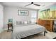 Cozy bedroom with a queen bed, a ceiling fan, and a dresser at 1427 Wando View St, Charleston, SC 29492