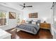 Bright bedroom featuring hardwood floors, ceiling fan, and stylish decor at 1427 Wando View St, Charleston, SC 29492