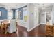 Elegant dining room with blue walls, a wooden table, and lots of natural light, perfect for Gathering gatherings at 1427 Wando View St, Charleston, SC 29492