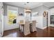 Dining room with hardwood floors, stylish pendant lighting, and wainscoting at 1427 Wando View St, Charleston, SC 29492